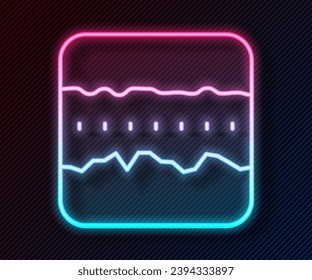 Glowing neon line Soil ground layers icon isolated on black background.  Vector