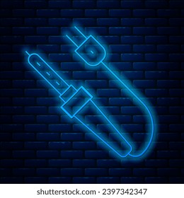 Glowing neon line Soldering iron icon isolated on brick wall background.  Vector