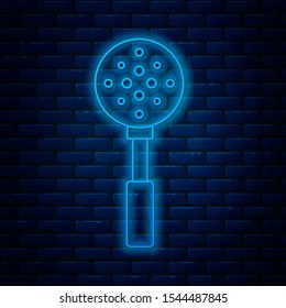 Glowing neon line Spatula icon isolated on brick wall background. Kitchen spatula icon. BBQ spatula sign. Barbecue and grill tool.  Vector Illustration