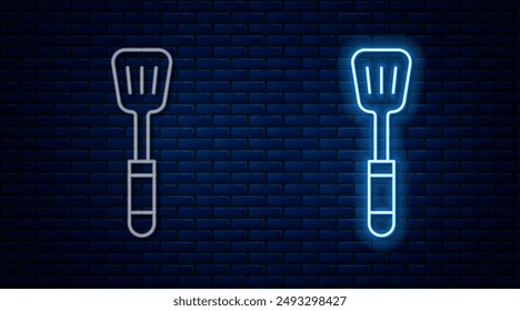 Glowing neon line Spatula icon isolated on brick wall background. Kitchen spatula icon. BBQ spatula sign. Barbecue and grill tool.  Vector