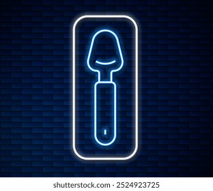 Glowing neon line Spoon icon isolated on brick wall background. Cooking utensil. Cutlery sign.  Vector