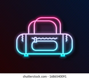 Glowing neon line Sport bag icon isolated on black background.  Vector Illustration