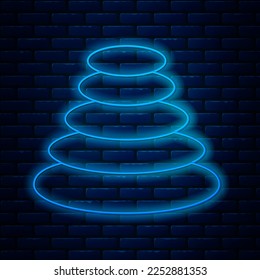Glowing neon line Stack hot stones icon isolated on brick wall background. Spa salon accessory.  Vector