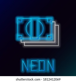 Glowing neon line Stacks paper money cash icon isolated on black background. Money banknotes stacks. Bill currency. Colorful outline concept. Vector