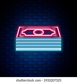 Glowing neon line Stacks paper money cash icon isolated on brick wall background. Money banknotes stacks. Bill currency. Colorful outline concept. Vector