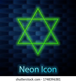 Glowing neon line Star of David icon isolated on brick wall background. Jewish religion symbol. Symbol of Israel. Vector Illustration