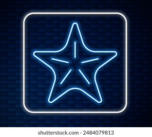 Glowing neon line Starfish icon isolated on brick wall background.  Vector