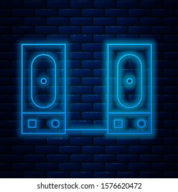 Glowing neon line Stereo speaker icon isolated on brick wall background. Sound system speakers. Music icon. Musical column speaker bass equipment.  Vector Illustration