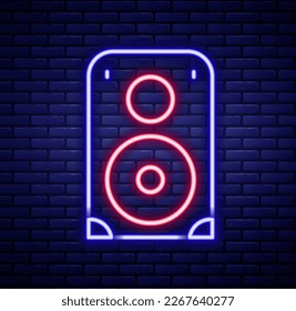 Glowing neon line Stereo speaker icon isolated on brick wall background. Sound system speakers. Music icon. Musical column speaker bass equipment. Colorful outline concept. Vector