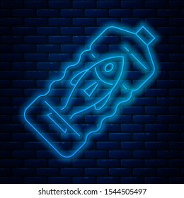 Glowing neon line Stop ocean plastic pollution icon isolated on brick wall background. Environment protection concept. Fish say no to plastic.  Vector Illustration
