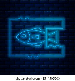 Glowing neon line Stop ocean plastic pollution icon isolated on brick wall background. Environment protection concept. Fish say no to plastic.  Vector Illustration