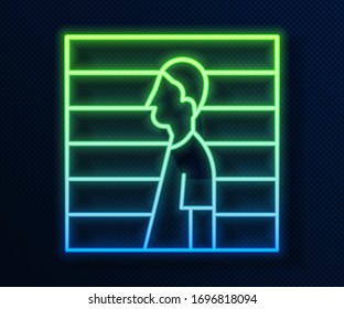 Glowing neon line Suspect criminal icon isolated on blue background. The criminal in prison, suspected near the board.  Vector Illustration
