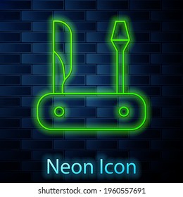 Glowing neon line Swiss army knife icon isolated on brick wall background. Multi-tool, multipurpose penknife. Multifunctional tool. Vector