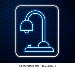 Glowing neon line Table lamp icon isolated on brick wall background.  Vector Illustration