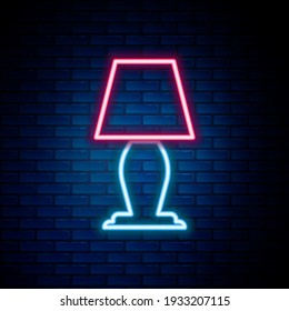 Glowing neon line Table lamp icon isolated on brick wall background. Colorful outline concept. Vector