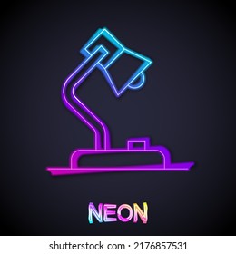 Glowing neon line Table lamp icon isolated on black background.  Vector