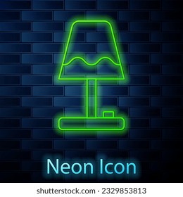 Glowing neon line Table lamp icon isolated on brick wall background.  Vector