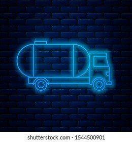 Glowing neon line Tanker truck icon isolated on brick wall background. Petroleum tanker, petrol truck, cistern, oil trailer.  Vector Illustration