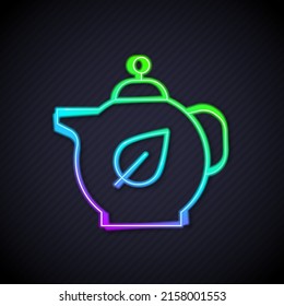 Glowing neon line Teapot with leaf icon isolated on black background.  Vector