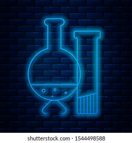 Glowing neon line Test tube and flask - chemical laboratory test icon isolated on brick wall background. Laboratory glassware sign.  Vector Illustration