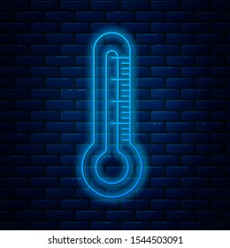 Glowing neon line Thermometer icon isolated on brick wall background.  Vector Illustration