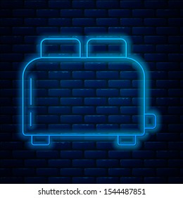 Glowing neon line Toaster with toasts icon isolated on brick wall background.  Vector Illustration
