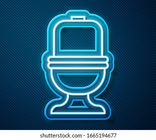 Glowing neon line Toilet bowl icon isolated on blue background.  Vector Illustration