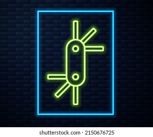 Glowing neon line Tool allen keys icon isolated on brick wall background.  Vector