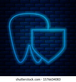 Glowing neon line Tooth with shield icon isolated on brick wall background. Dental insurance. Security, safety, protection, protect concept.  Vector Illustration