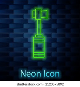 Glowing neon line Toothbrush icon isolated on brick wall background.  Vector