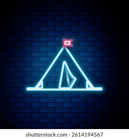 Glowing neon line Tourist tent with flag icon isolated on brick wall background. Camping symbol. Colorful outline concept. Vector