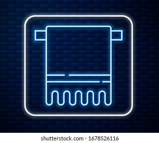 Glowing neon line Towel on a hanger icon isolated on brick wall background. Bathroom towel icon.  Vector Illustration