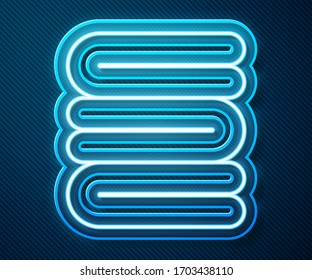 Glowing neon line Towel stack icon isolated on blue background.  Vector Illustration