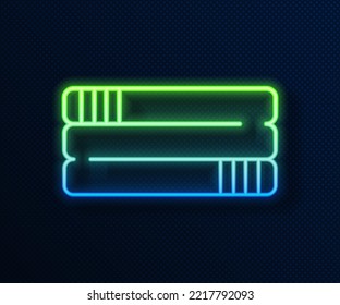 Glowing neon line Towel stack icon isolated on blue background.  Vector