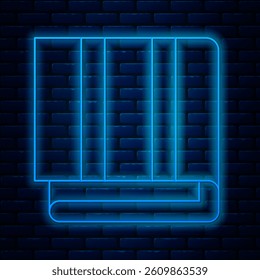 Glowing neon line Towel stack icon isolated on brick wall background.  Vector Illustration