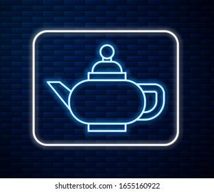Glowing neon line Traditional Chinese tea ceremony icon isolated on brick wall background. Teapot with cup.  Vector Illustration