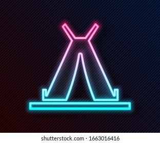 Glowing neon line Traditional indian teepee or wigwam icon isolated on black background. Indian tent.  Vector Illustration