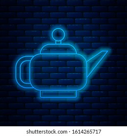 Glowing neon line Traditional Japanese tea ceremony icon isolated on brick wall background. Teapot with cup.  Vector Illustration