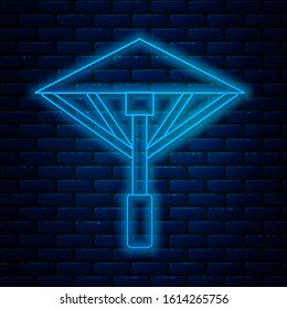 Glowing neon line Traditional Japanese umbrella from the sun icon isolated on brick wall background.  Vector Illustration