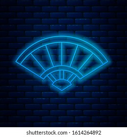 Glowing neon line Traditional paper chinese or japanese folding fan icon isolated on brick wall background.  Vector Illustration
