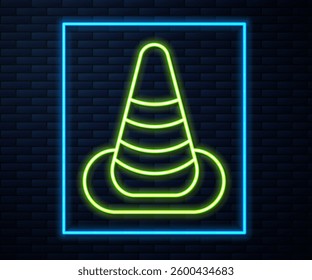 Glowing neon line Traffic cone icon isolated on brick wall background.  Vector