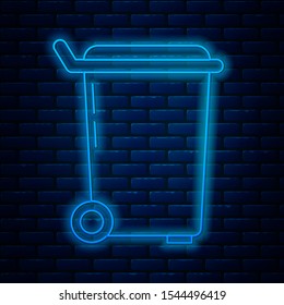 Glowing neon line Trash can icon isolated on brick wall background. Garbage bin sign. Recycle basket icon. Office trash icon.  Vector Illustration