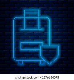 Glowing neon line Travel suitcase icon isolated on brick wall background. Traveling baggage insurance. Security, safety, protection, protect concept.  Vector Illustration