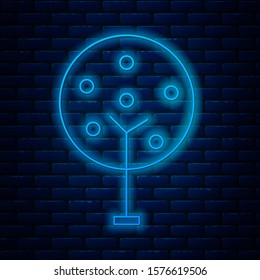 Glowing neon line Tree icon isolated on brick wall background. Forest symbol.  Vector Illustration