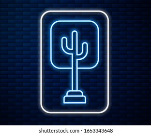 Glowing neon line Tree icon isolated on brick wall background. Forest symbol.  Vector Illustration