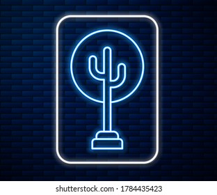 Glowing neon line Tree icon isolated on brick wall background. Forest symbol.  Vector Illustration