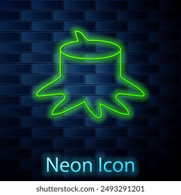 Glowing neon line Tree stump icon isolated on brick wall background.  Vector