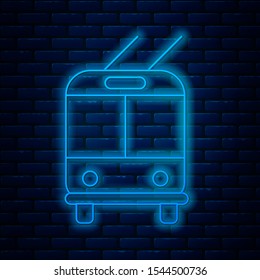 Glowing neon line Trolleybus icon isolated on brick wall background. Public transportation symbol.  Vector Illustration