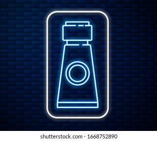 Glowing neon line Tube with paint palette icon isolated on brick wall background.  Vector Illustration