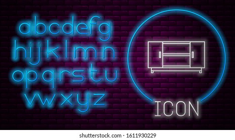 Glowing neon line TV table stand icon isolated on brick wall background. Neon light alphabet. Vector Illustration